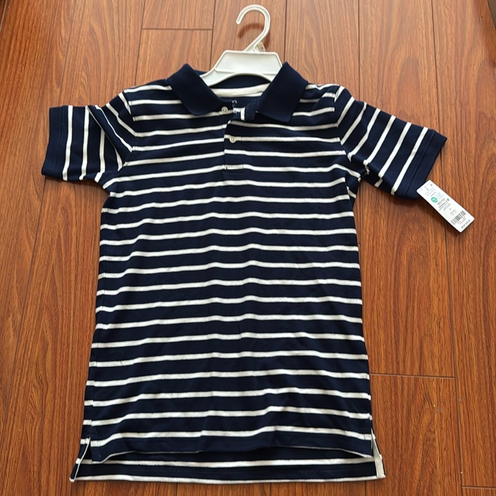 Carter’s boy polo. Size 8. Navy and white
NWT Size 12/12A